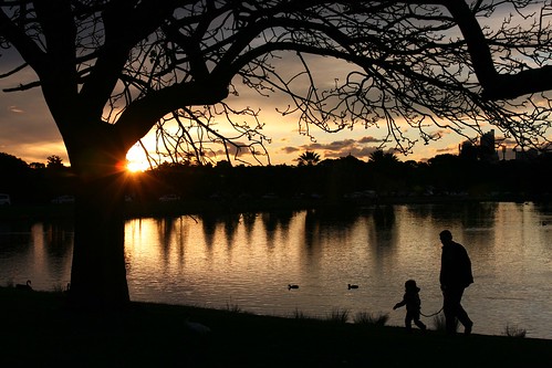Father and Daughter, Sunset at Centennial Park Sydney Australia by Alex E. Proimos