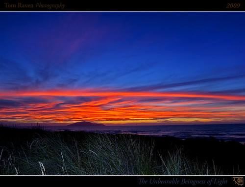 sunset sea newzealand sky sun clouds geotagged interestingness surf framed flash explore grasses 2009 kapitiisland 50000views explored otakibeach inexplore 60explore tomraven geo:lat=40734511 geo:lon=175117478 q109