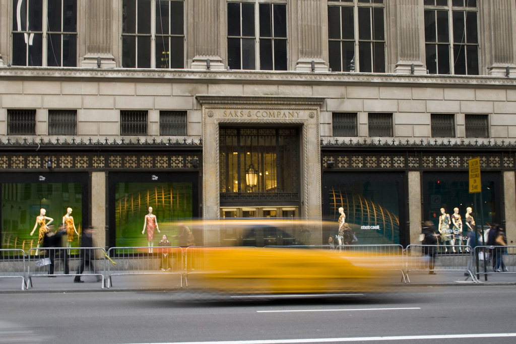 A yellow cab outside Saks & Company, 5th avenue, New York City.