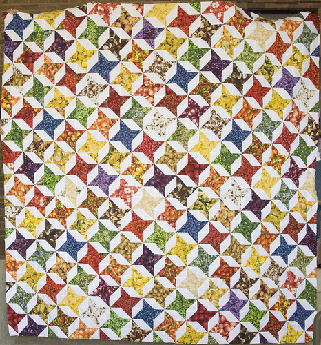 Um. Holy crap. 'Eat This Quilt' is huge.  It took three co-workers holding the quilt top over the railing to get this shot. It's 100' square ... a beast. I've worked on it off and on for a year, with a significant break after my husband's near-fatal accident back in December.

Quilting it is going to be ... uh ... *shudders*

Humorous note: I jokingly called it Eat This Quilt because all of the colors are food fabrics. I ended up picking Tamara as a recipient because she and her husband are vegan (partly through ethics and partly through some serious allergies on his part) and she confirmed they could eat every food shown on this quilt. That is, as long as the potato chips aren't fried in peanut oil. :)

Info on the fabrics: domesticat.net/quilts/eat-quilt