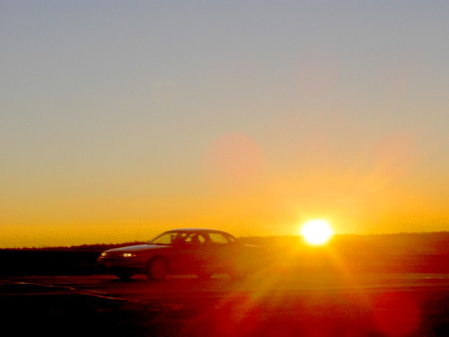 sunrise morning car driving solarflare sky dramatic vibrant sun samoff