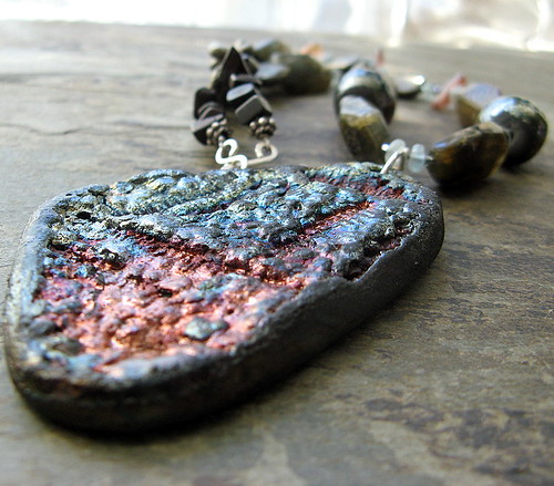 flashes | The pendant in an amazing piece of raku clay, hand… | Flickr