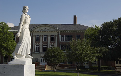 Pioneer Woman with Visual Arts building in the background
