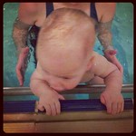 George trying to climb out of the pool on his own!