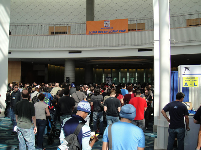 Fans enter the convention hall for the first time