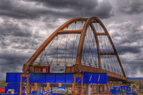 Moving a Bridge by Thad Roan - Bridgepix, The new Sixth Avenue Light Rail Bridge gets ready to be moved into place over the Highway this weeke