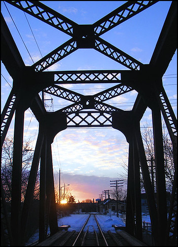 old iron bridge rails peterborough ontario canada sunset blue sun architecture perspective lines angles twilight ibeams beams 20thcentury winter truss outdoor town townpeterborough railbridge