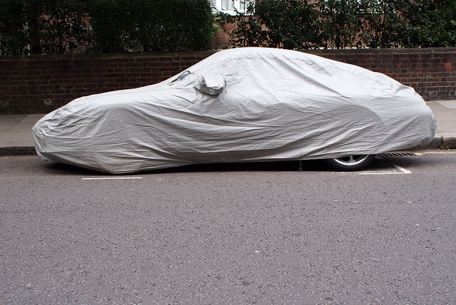 Car under a tarp