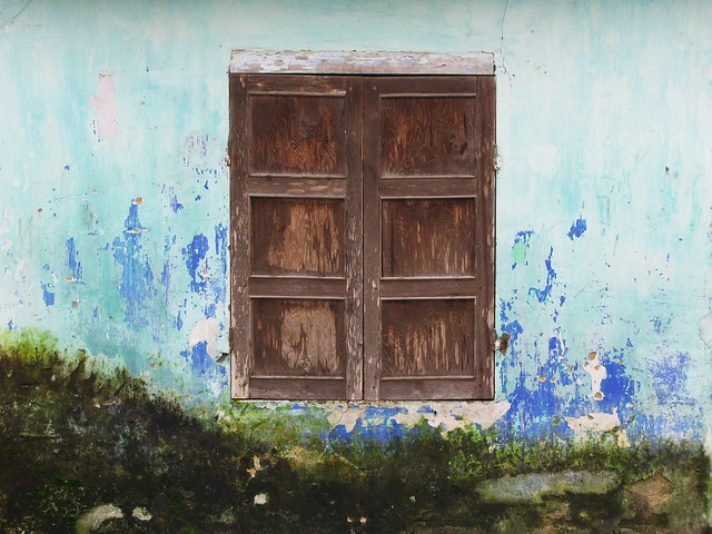 Moldy, damp blue wall and window - Hoi An, Vietnam