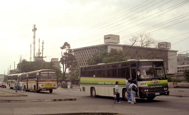 23740 (249) 11-03-1990 Saulog Transit Inc. Hino DGJ-518 (fleet No 604), Trifmann Hino DVS-749 (fleet No 41424) in the Lawton area of Manila, Philippines.