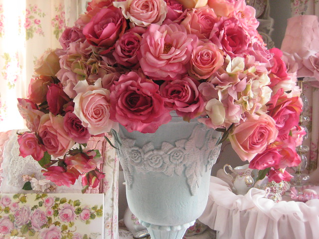PInk roses in floral swag urn