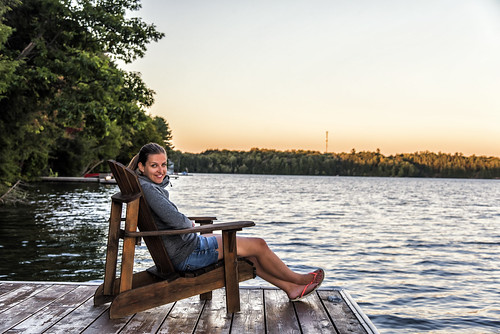 girl seat chair lake water muskoka ontario canada cottage north america sunset dawn sun sky clear evening warm september 2016 holiday trip summertime portrait women smile