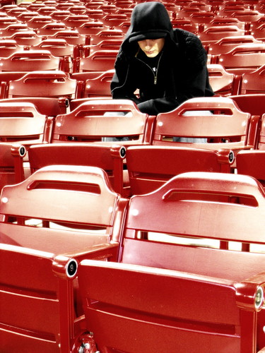light red portrait selfportrait black face crimson self hoodie glow bright seat numbers rows seats same repetition glowing repeat identical cloaked disguised in hundreds grandstands colourartaward greeneyephoto inthecrimsongrandstands