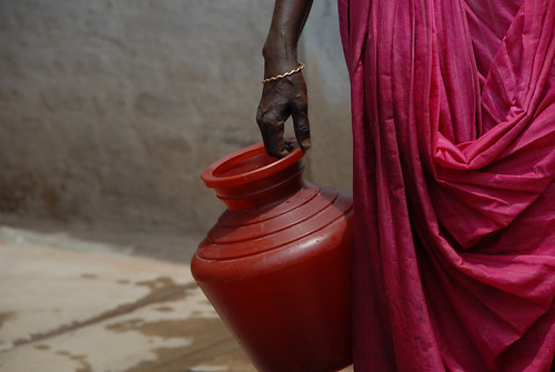 Woman holding water vessel | by waterdotorg