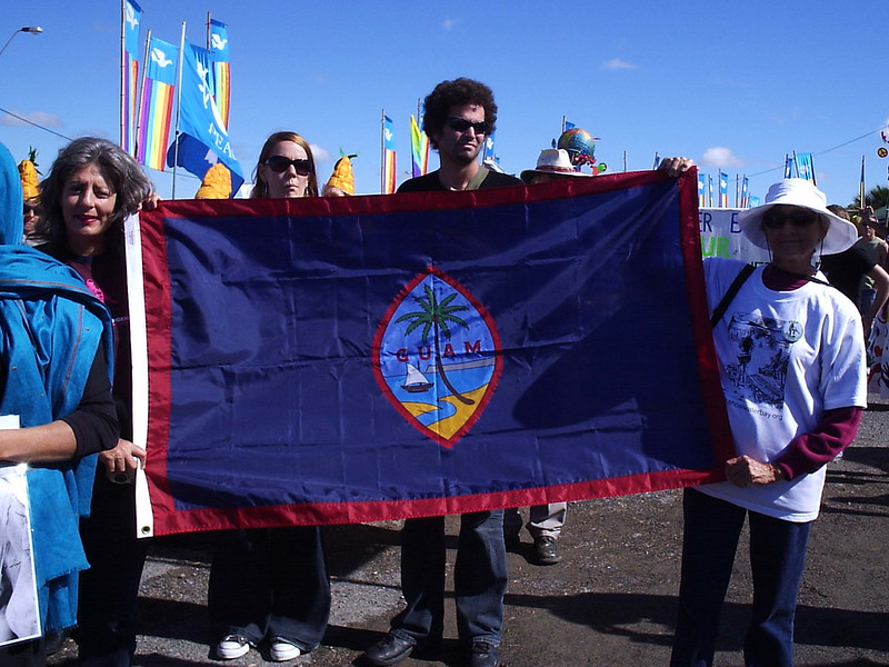 Members of the local community hold the Guam flag at a protest during a regional military exercise in 2007.

Fanai Castro