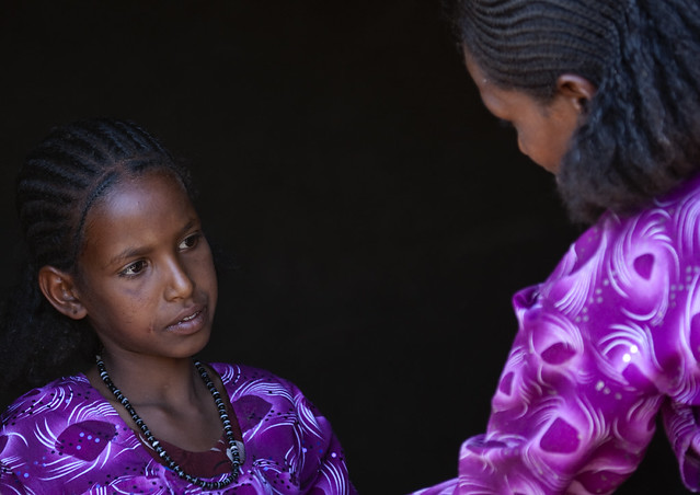 Mother and daughter wearing the same colourful clothes, Ethiopia