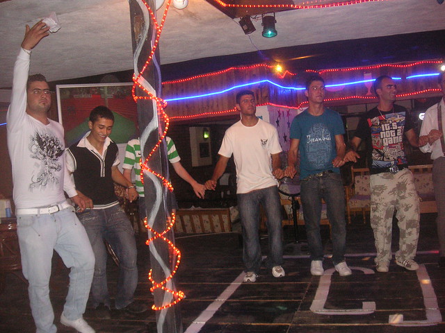 Nic doing a Turkish dance with staff at CJ's