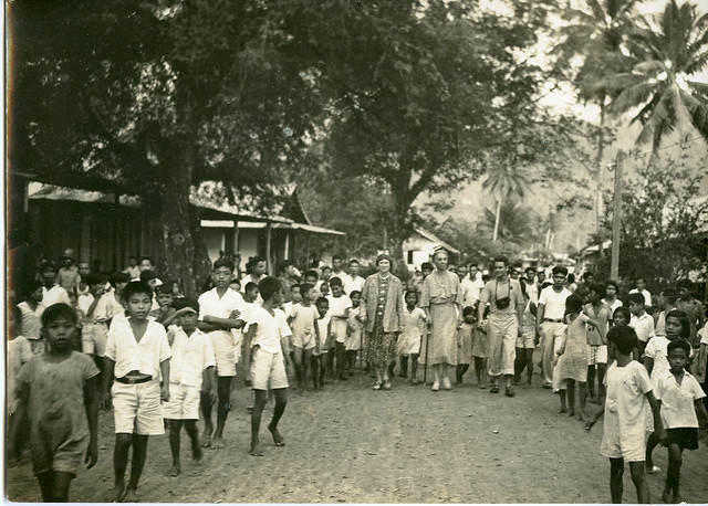 Indonesian children following Anne and Marian