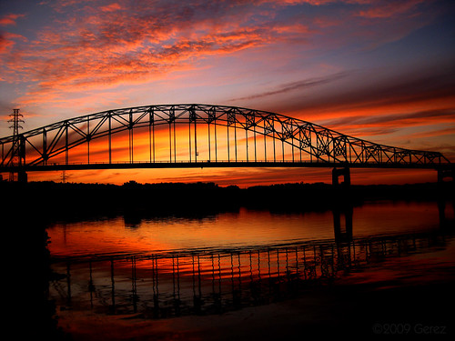 old bridge sunset sky man minnesota clouds river mississippi hastings