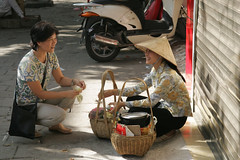 May/2007 - Lucy Lapar, ILRI scientist, with a poultry produce trader selling eggs on the streets of Hanoi (photo credit: ILRI/Stevie Mann).