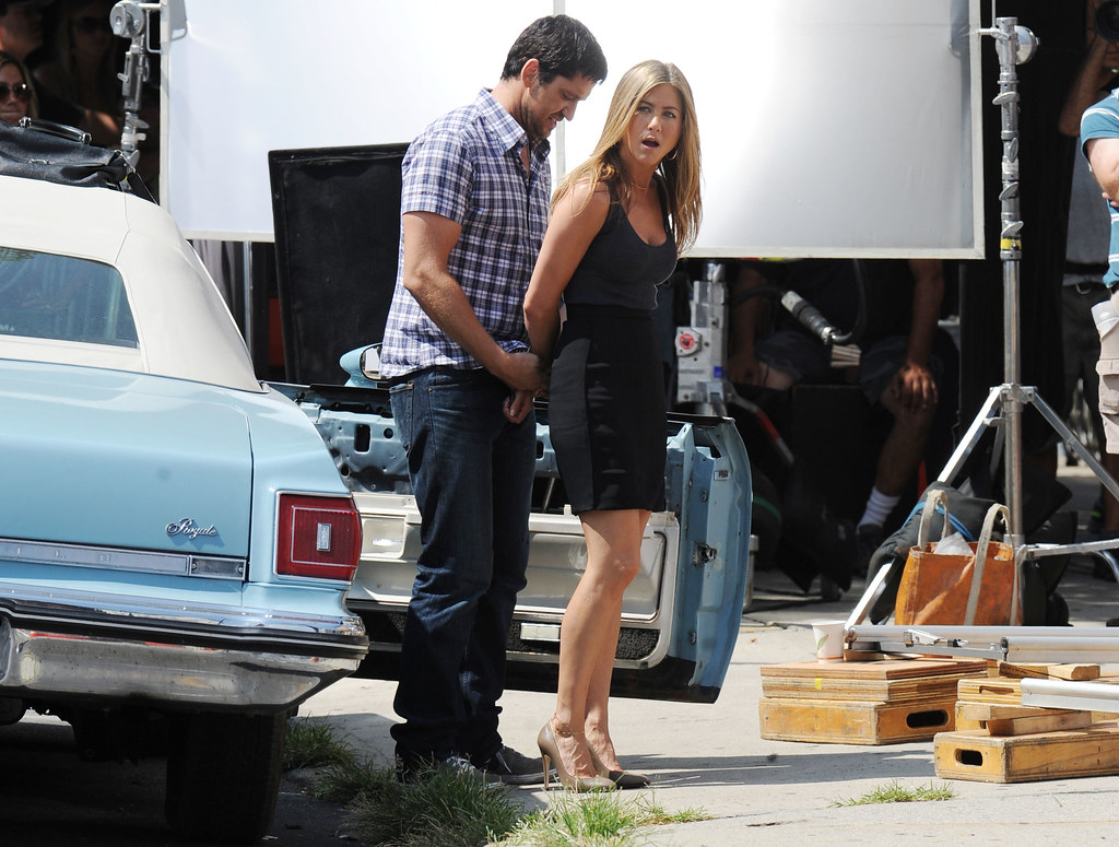 Jennifer Aniston handcuffed on movie set.