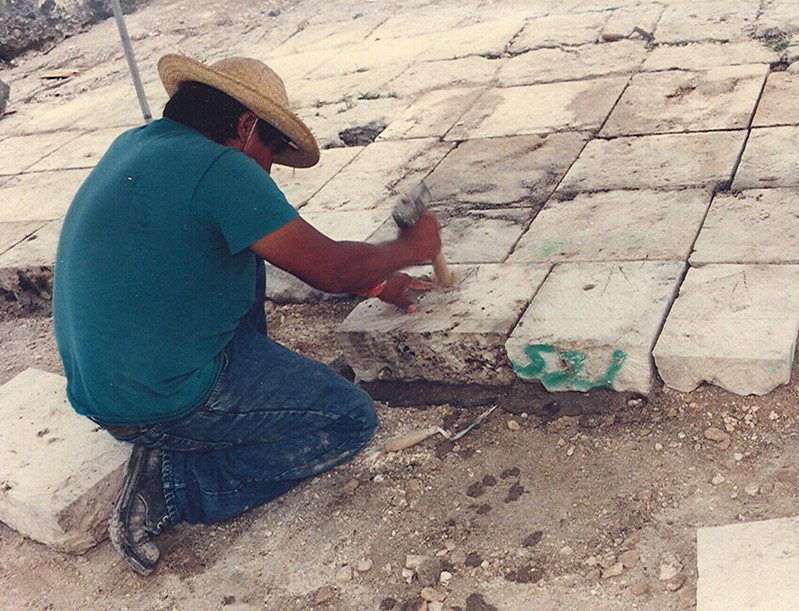 Figure 5. A mason working on the batalan, a terrace, at Fort Soledad, Umatac.

Lawrence J. Cunningham