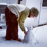Rosie putting the finishing touches to the snowman for George