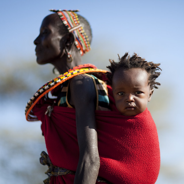 Samburu mother carrying her baby on her back - Kenya