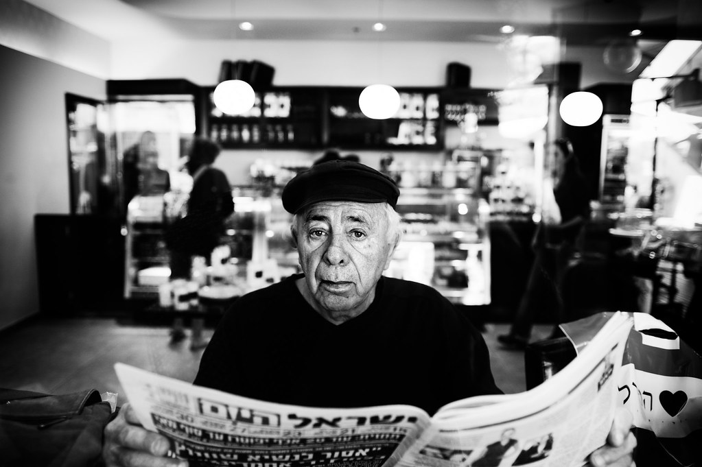 a man reading the "Israel Today" newspaper by Rundadar