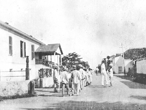 Young men of the town walk the streets in their Sunday best. The population of Chamorros in 1900 was 9,000.

Charles Lemkuhl/Micronesian Seminar

