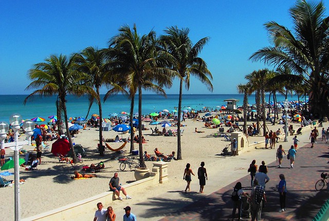 Throngs of people out on a sunny Hollywood Beach weekend afternoon