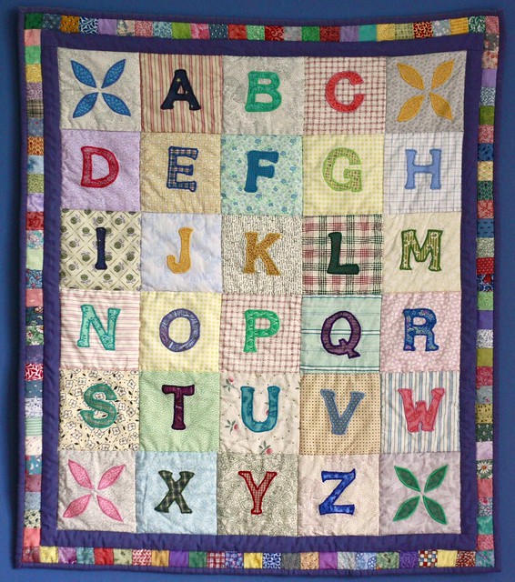 Scrappy alphabet patchwork quilt.