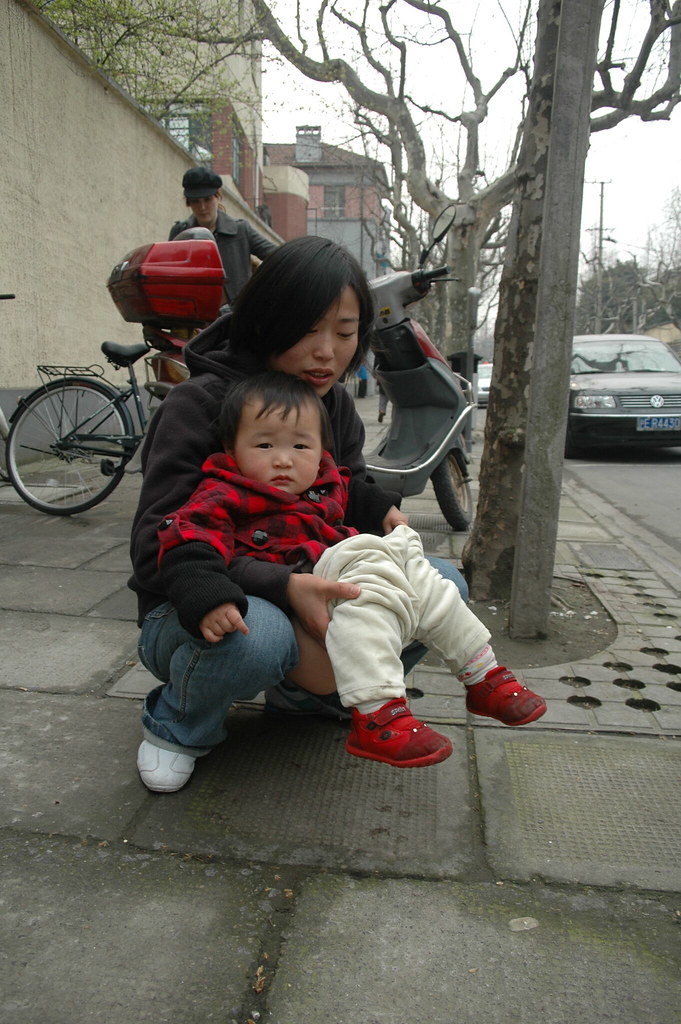 Mother helps toddler go potty on street in China | A mother … | Flickr