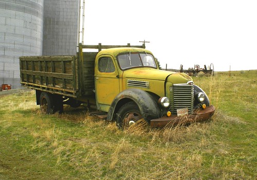 Farm Truck Beauty by swainboat, This is another view of an old abandoned 1938 Intrernational truck. A hay rake sits in a field behin