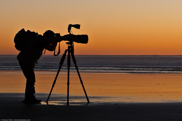 Student shown here in silhouette.  Arthur Morris leads an advanced Instructional Photo Tour class on Morro Strand State Beach 13 Jan. 2009