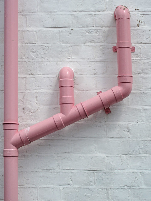 Pink Pipes On A White Wall