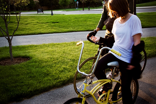 sunset tree girl grass yellow dusk bikes quad bicycles sidewalk