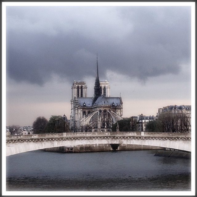 Rita Crane Photography:  France / Paris / Notre Dame / bridge / river / La Seine / clouds / rain / Notre Dame & Pont de la Tournelle, Paris