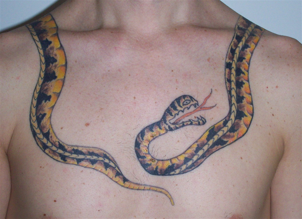 old school snake tattoo around neck and shoulder by tattootrix.
