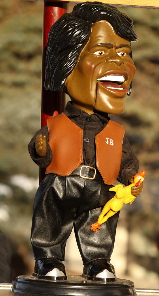 James Brown doll on a hot dog stand doing very good business at the Iditarod starting point