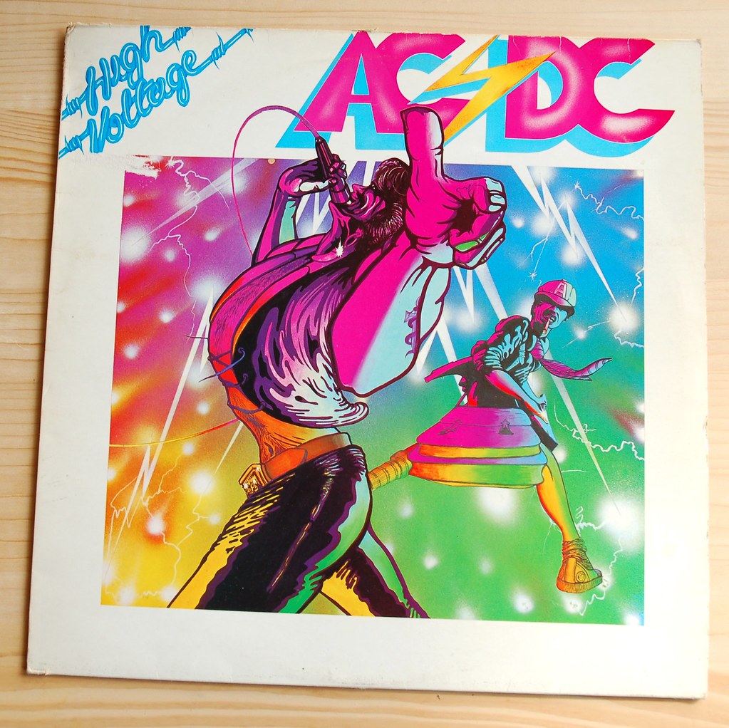 Dc volts. AC/DC - High Voltage винил. AC DC High Voltage обложка. 1976 - High Voltage обложка. AC DC High Voltage 1975 обложка.