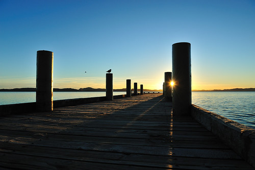 ocean blue newzealand sky orange sun water sunrise auckland wharf maraetai aotearoa