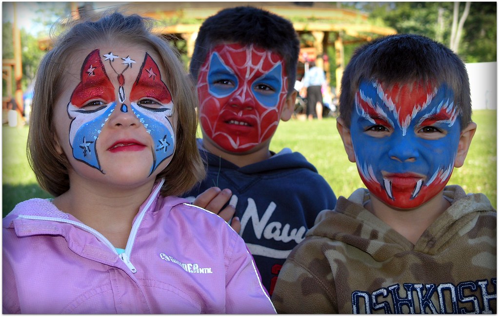 Red white and blue face paint, At the Pow Wow. Kids got the…