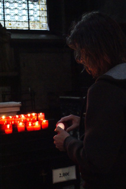 Martijn lighting a candle