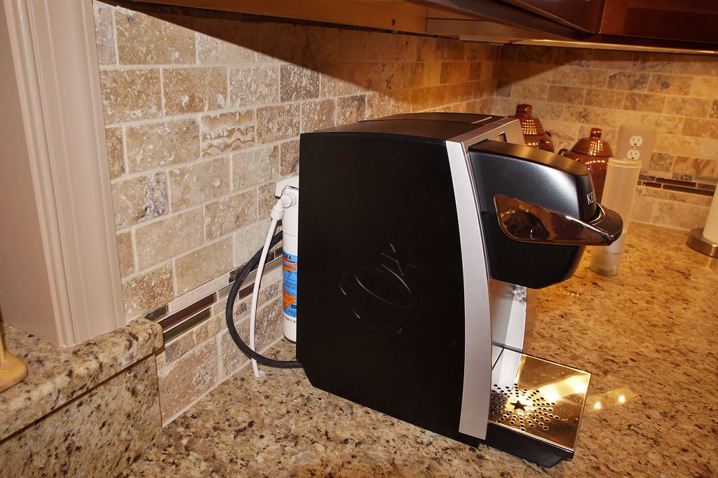 AFTER- A close-up of the coffee maker shows the water line…