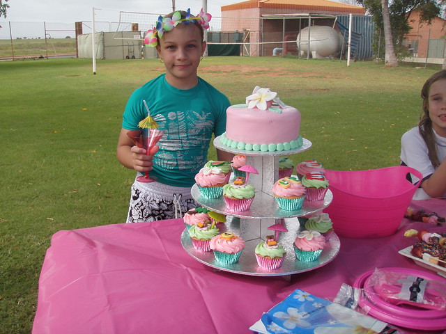 Mossy's masterpiece Gracie with her Luau Cake & cupcakes at Karratha pools