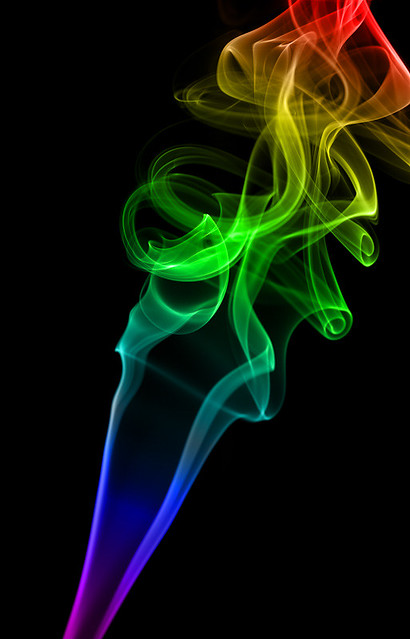 Abstract rainbow color smoke on black background