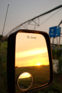 Sunrise through rear-view mirror