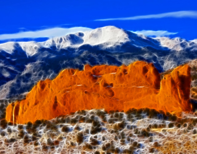 Pikes Peak Mountain, Kissing Camels red rocks in the foreground, Garden of the Gods Park in Colorado Springs, CO USA, America the Beautiful