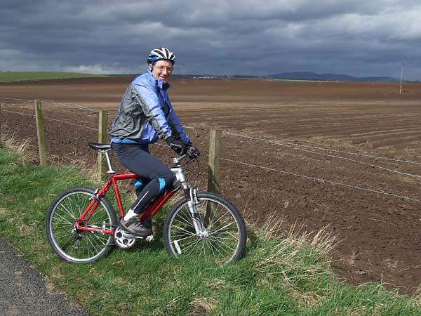 Peter my Biker friend in front of a Ploughed Field in Angus, Scotland.